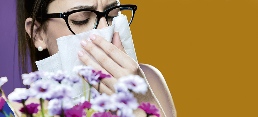 allergic to pollen young girl with a bouquet of flowers